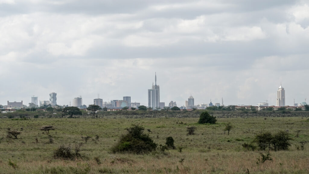 Nairobi skyline rising above the savannah of Nairobi National Park