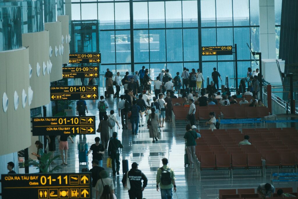 Travelers at a busy airport terminal